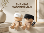 Leg-shaking wooden doll